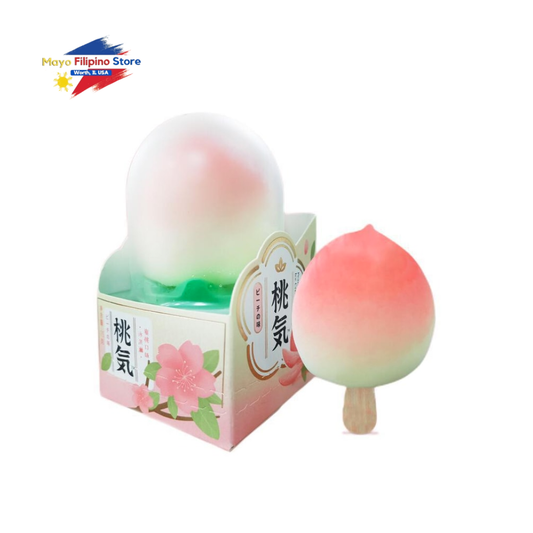 Peach-flavored ice cream on a stick with packaging featuring floral designs and text.