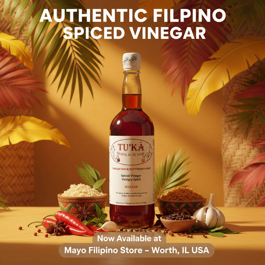 A bottle of Tu'Ka Spiced Vinegar with a white label and silver cap, shown against a plain white background with a 'Mayo Filipino Store' watermark in the bottom right corner.