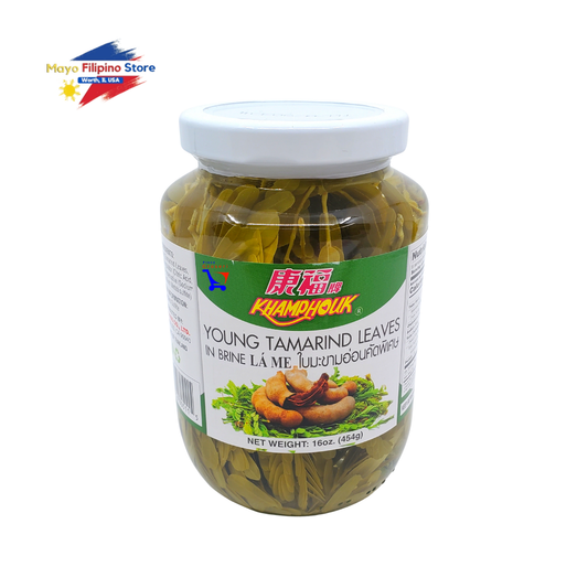 Jar of young tamarind leaves with a white lid on a white background, featuring the Kamyouk brand.